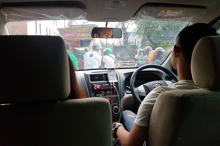 In Indonesia, travelers may now rent a Grab car by the ...