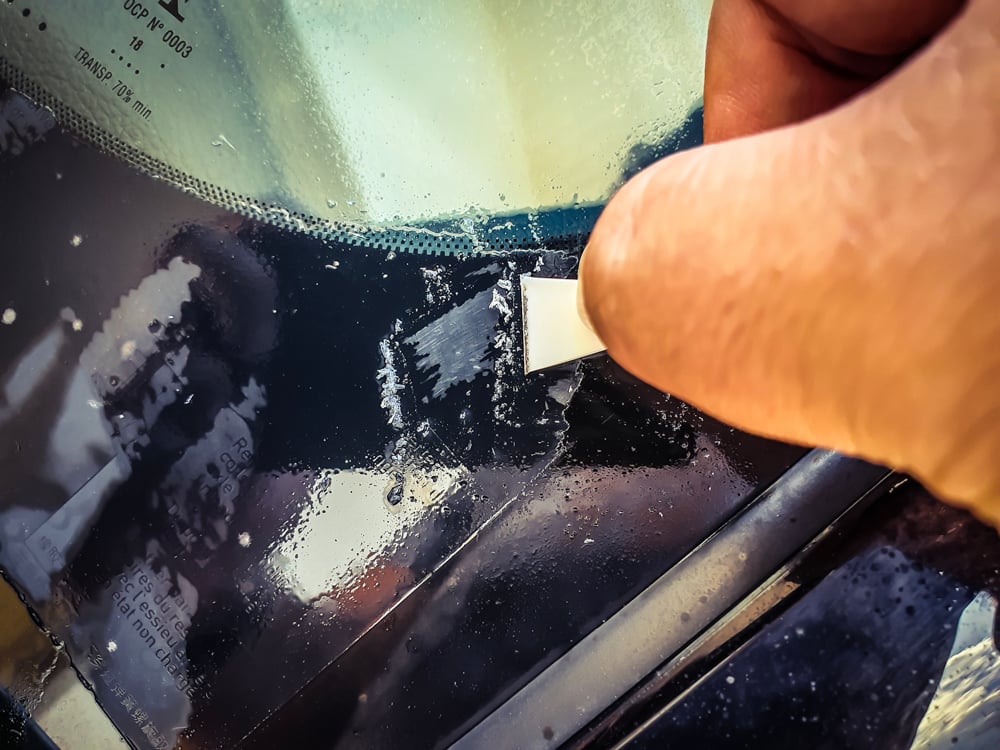 How to safely remove stickers from your car's glass parts